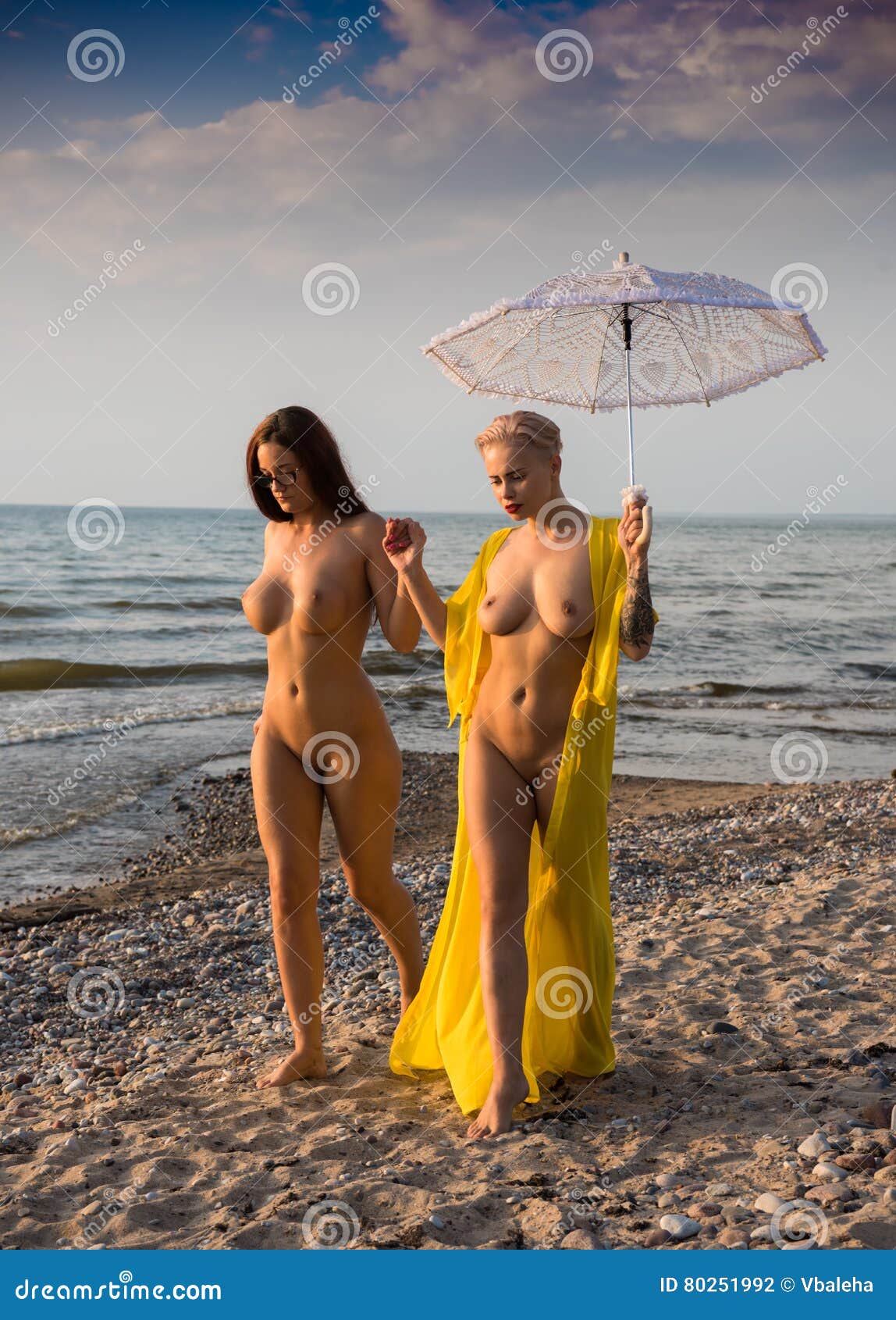 nude women walking on beach